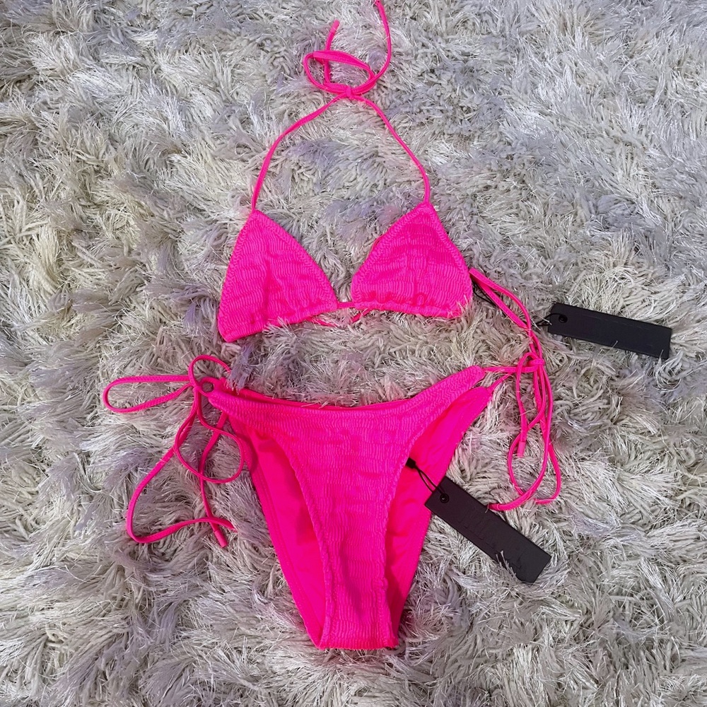SUPER CUTE pink triangl swimsuit. The top is a xs and the bottoms are a small!